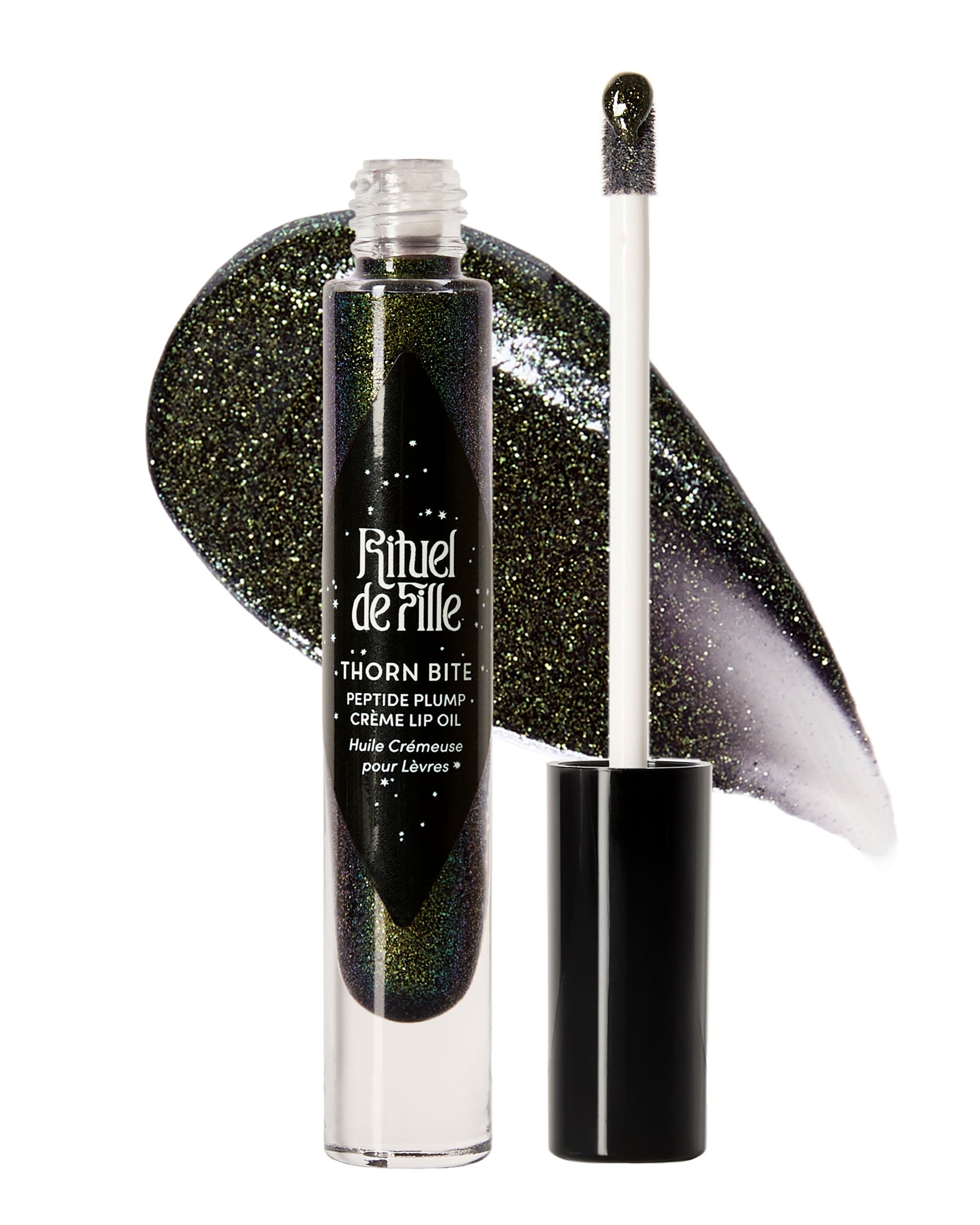 Tube of Night Glow Thorn Bite lip oil shown with swatch