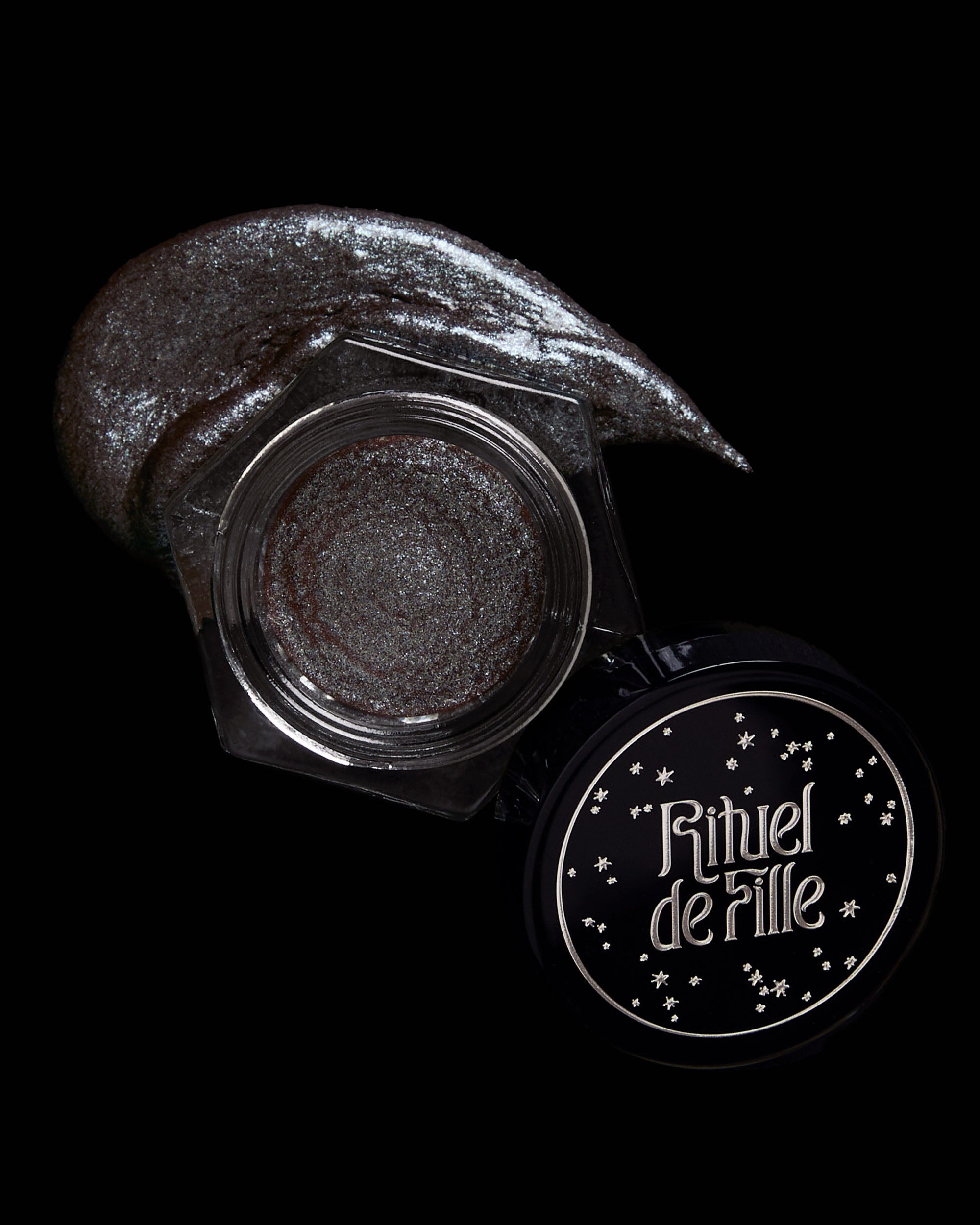 Eye makeup with 'Rituel de Fille' branding on a black background
