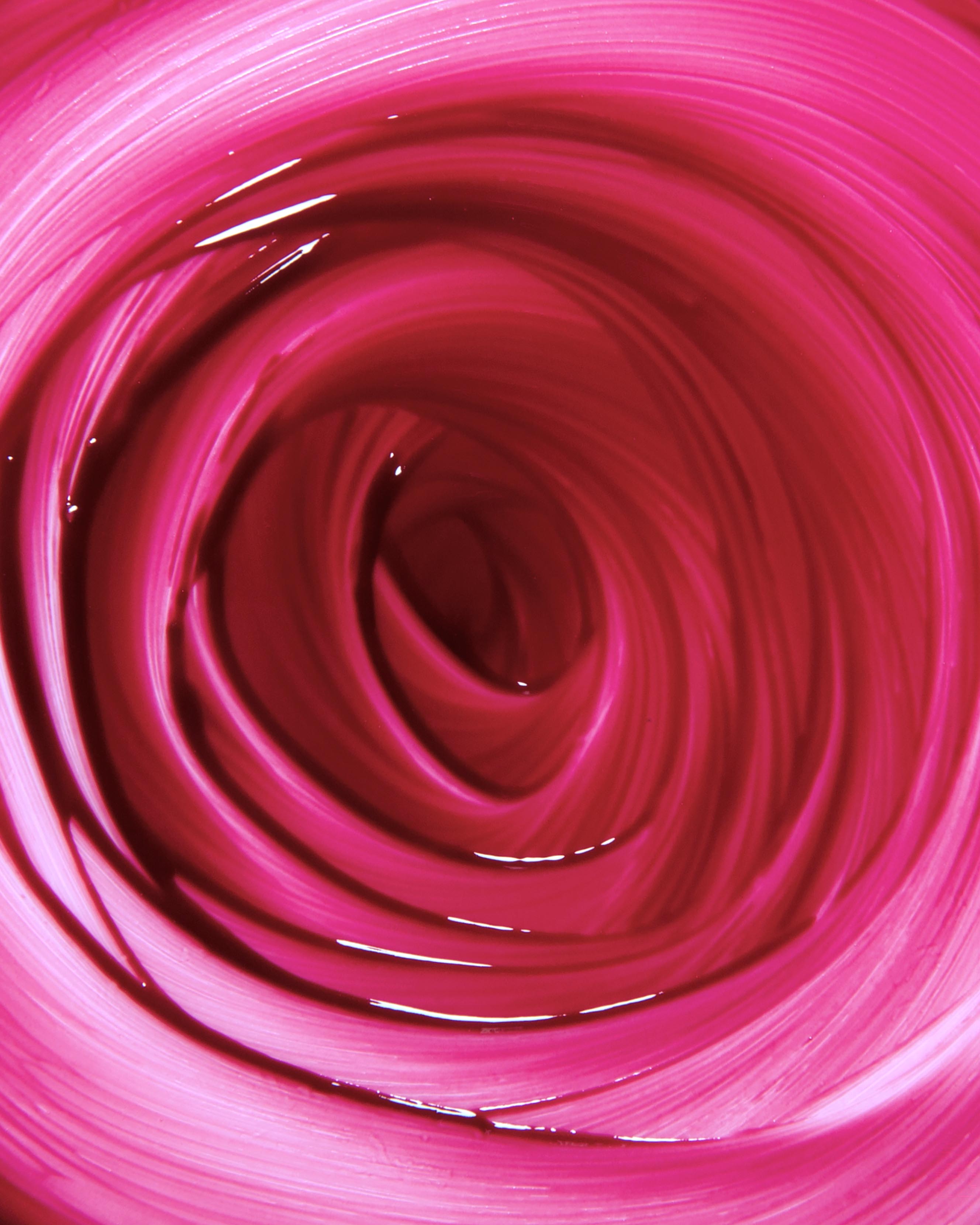 Close-up of purple makeup swirled in a circular pattern